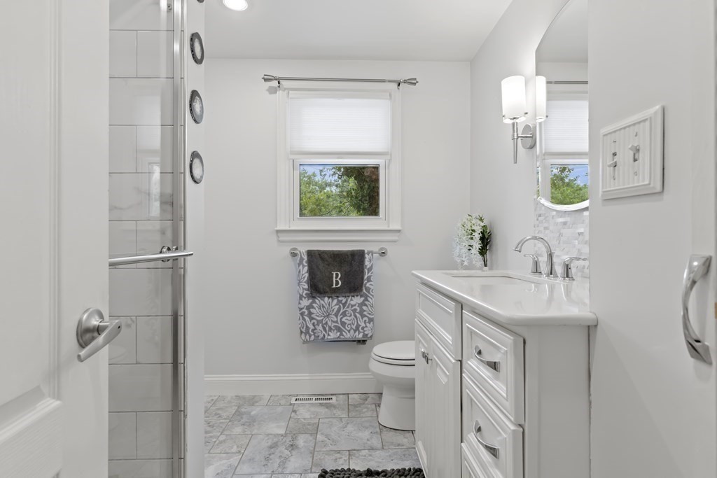 28 Edgewood Road Holbrook, MA 02343 - Photo 10 of 29 a bathroom with a sink toilet and shower
