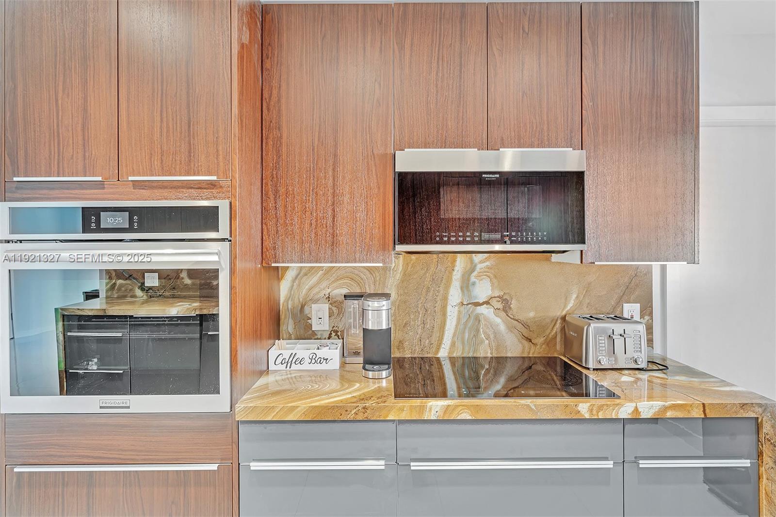 5005 Johnson Street Hollywood, FL 33021 - Photo 11 of 39 a kitchen with a stove and a microwave