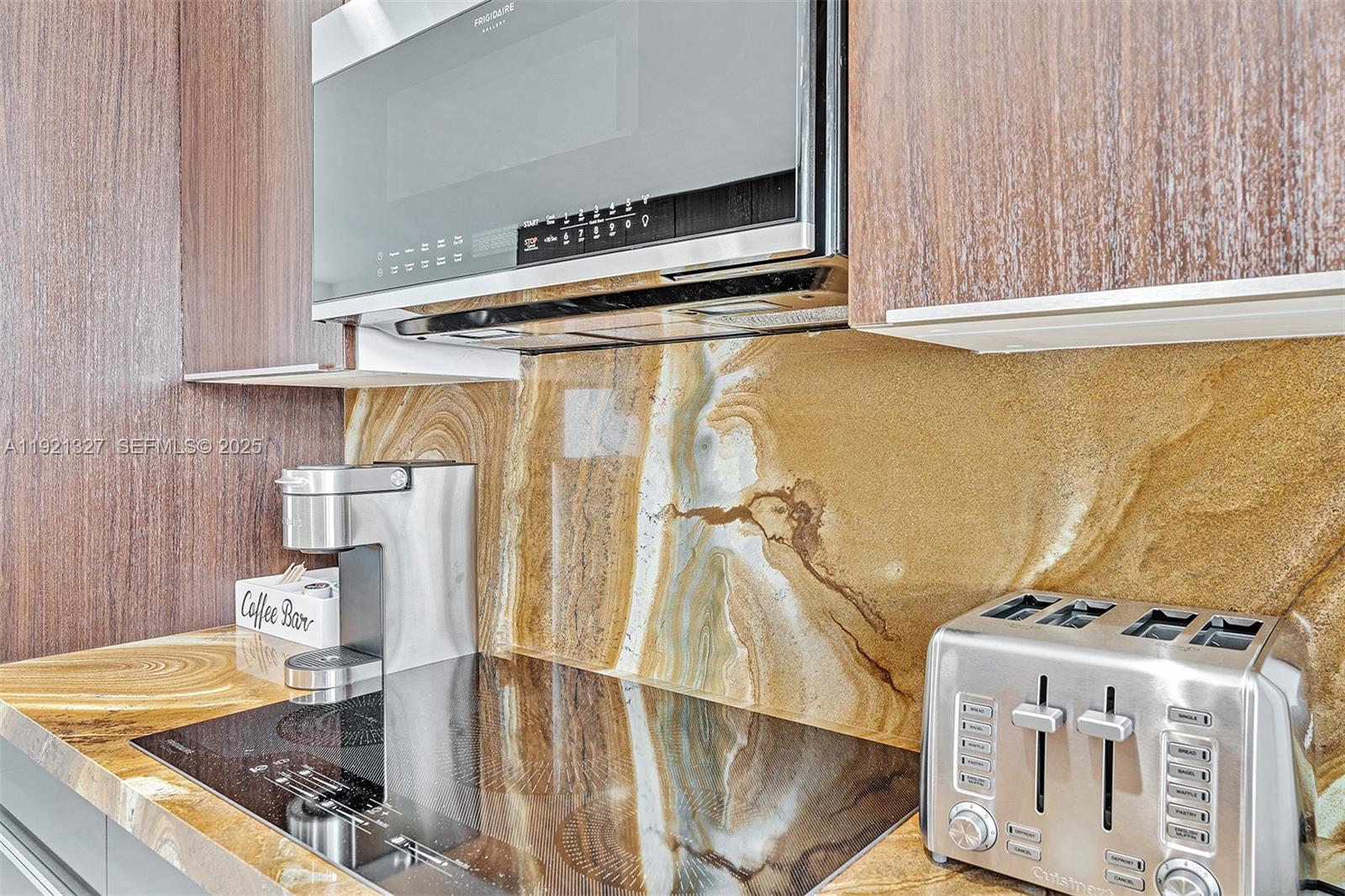 5005 Johnson Street Hollywood, FL 33021 - Photo 12 of 39 a view of water heater room with wooden floor