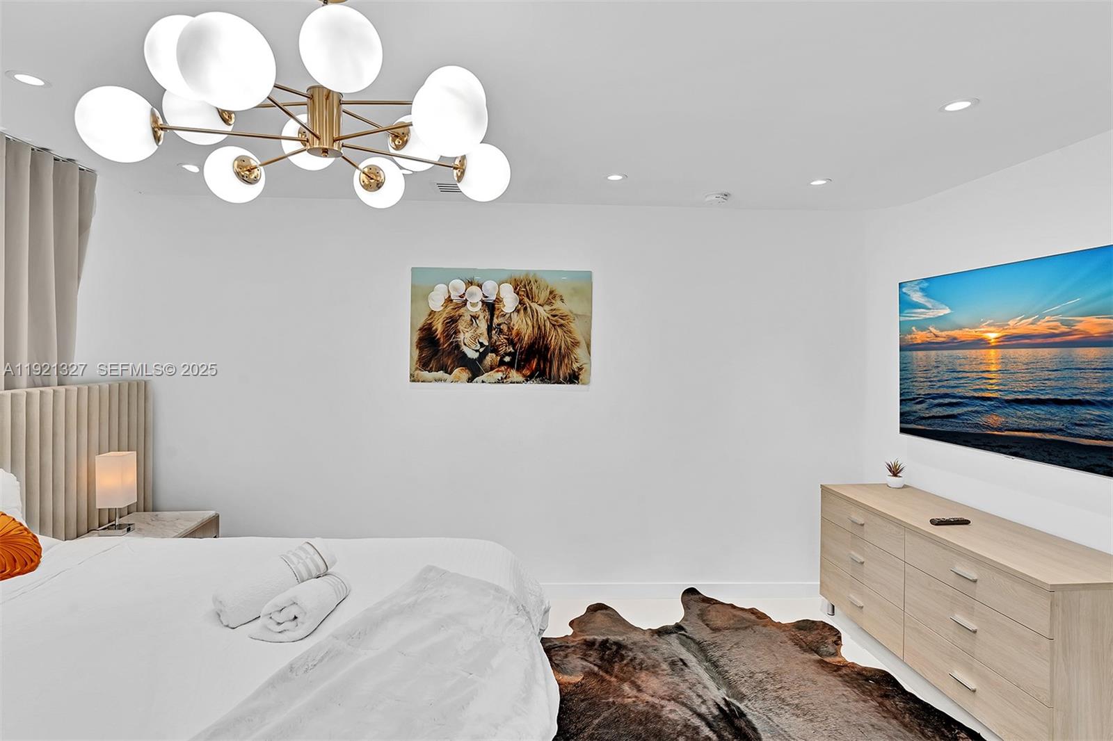 5005 Johnson Street Hollywood, FL 33021 - Photo 17 of 39 a bedroom with a bed and dresser