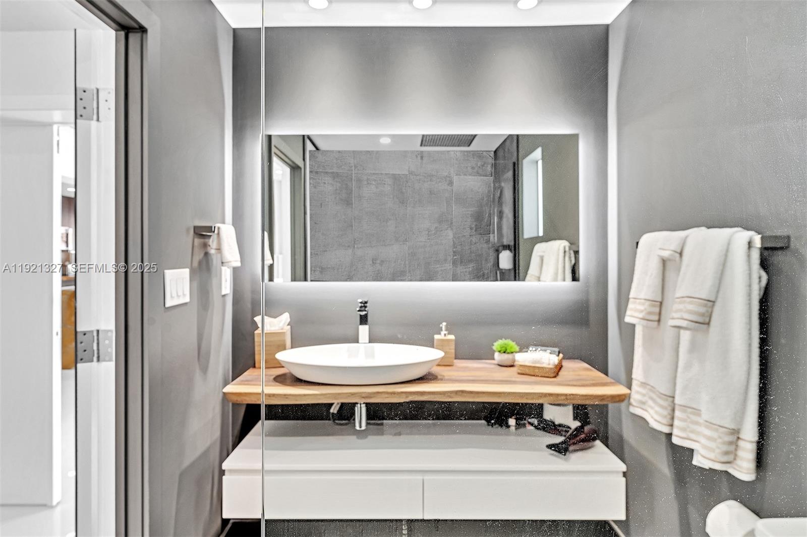 5005 Johnson Street Hollywood, FL 33021 - Photo 20 of 39 a living room with furniture and a table