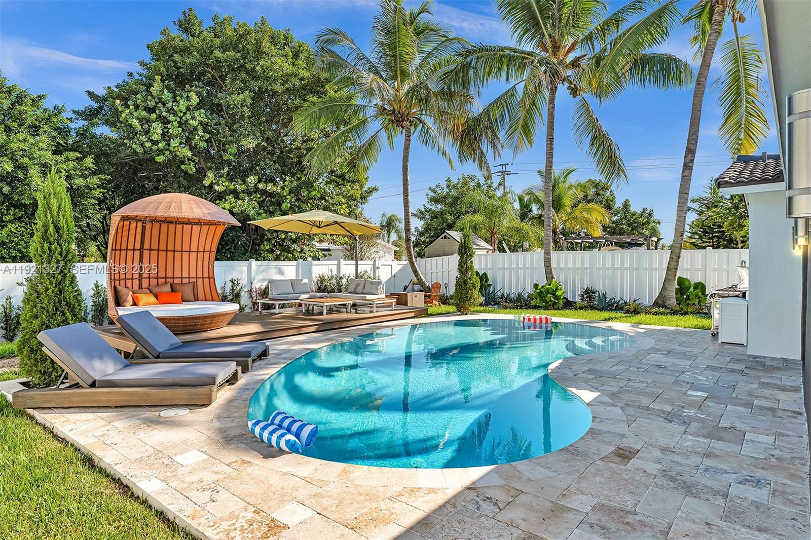5005 Johnson Street Hollywood, FL 33021 - Photo 21 of 39 a view of swimming pool with outdoor seating and plants