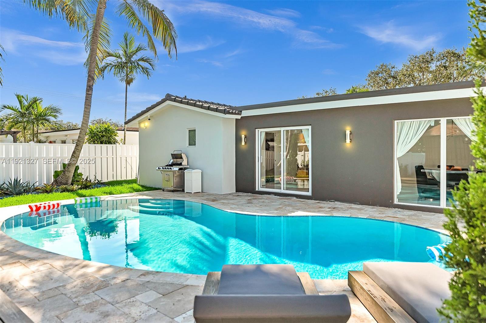 5005 Johnson Street Hollywood, FL 33021 - Photo 30 of 39 a view of a house with a swimming pool