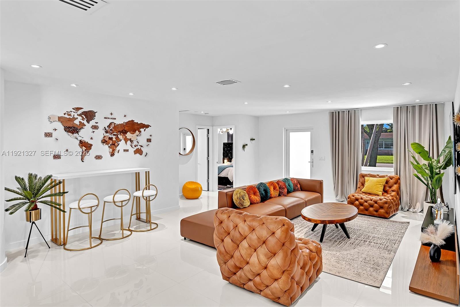 5005 Johnson Street Hollywood, FL 33021 - Photo 8 of 39 a living room with furniture and white walls