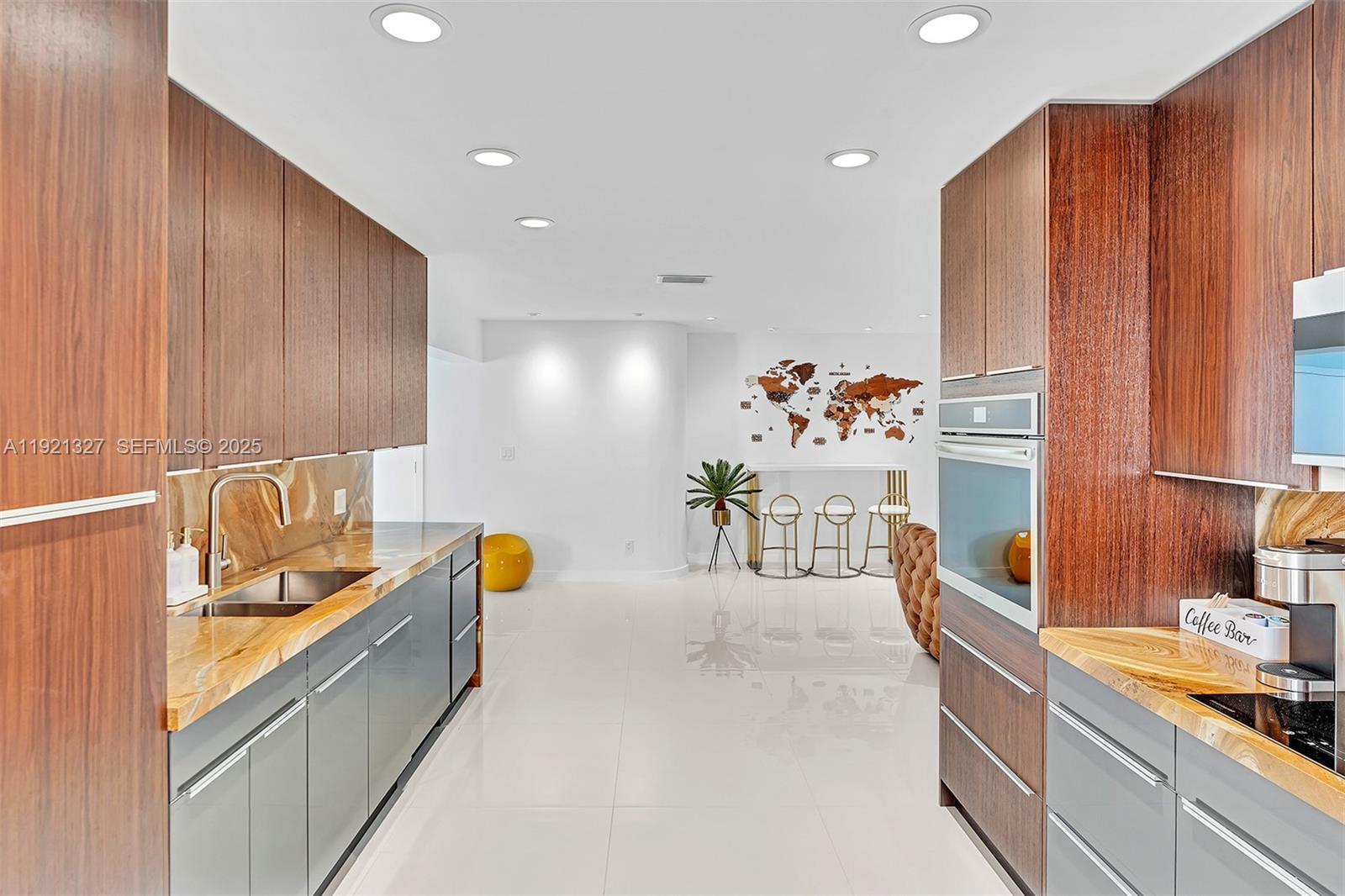 5005 Johnson Street Hollywood, FL 33021 - Photo 10 of 39 a view of a kitchen with a sink and breakfast area