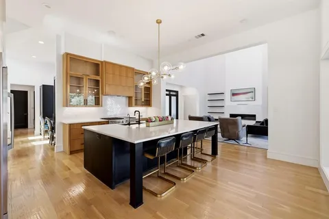a kitchen with counter top space and sink