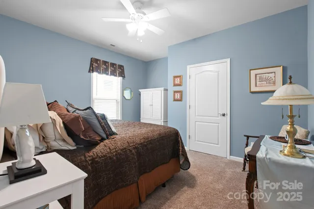 a bedroom with a bed and a table