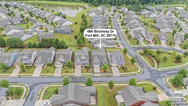 an aerial view of residential house with outdoor space and parking