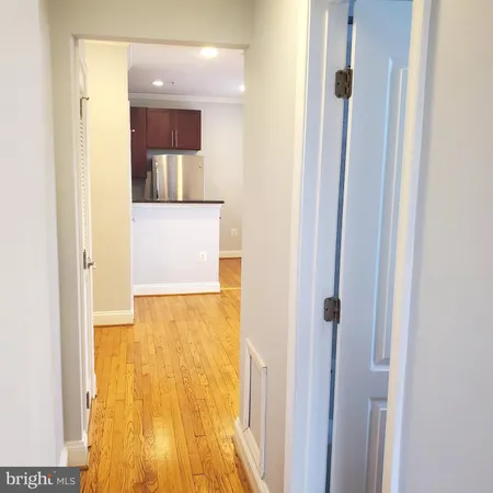 a view of a bathroom from a hallway