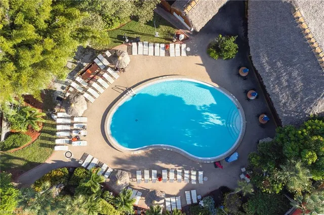 an aerial view of a swimming pool and outdoor space