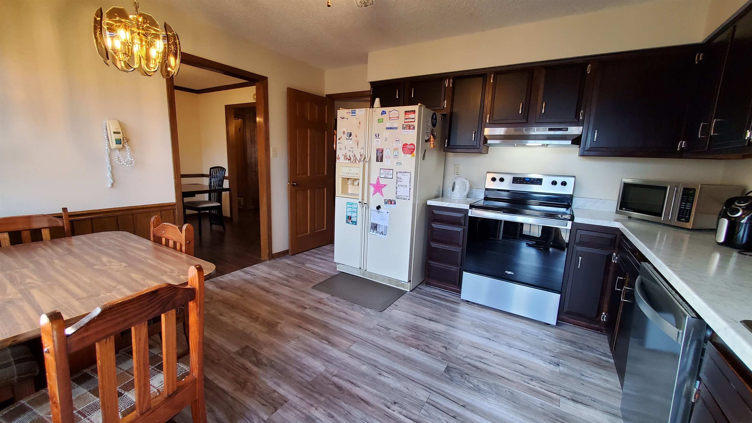 4192 Shadowfall Drive Memphis, TN 38141 - Photo 12 of 24 a kitchen with stainless steel appliances granite countertop a refrigerator a stove top oven a sink and dishwasher