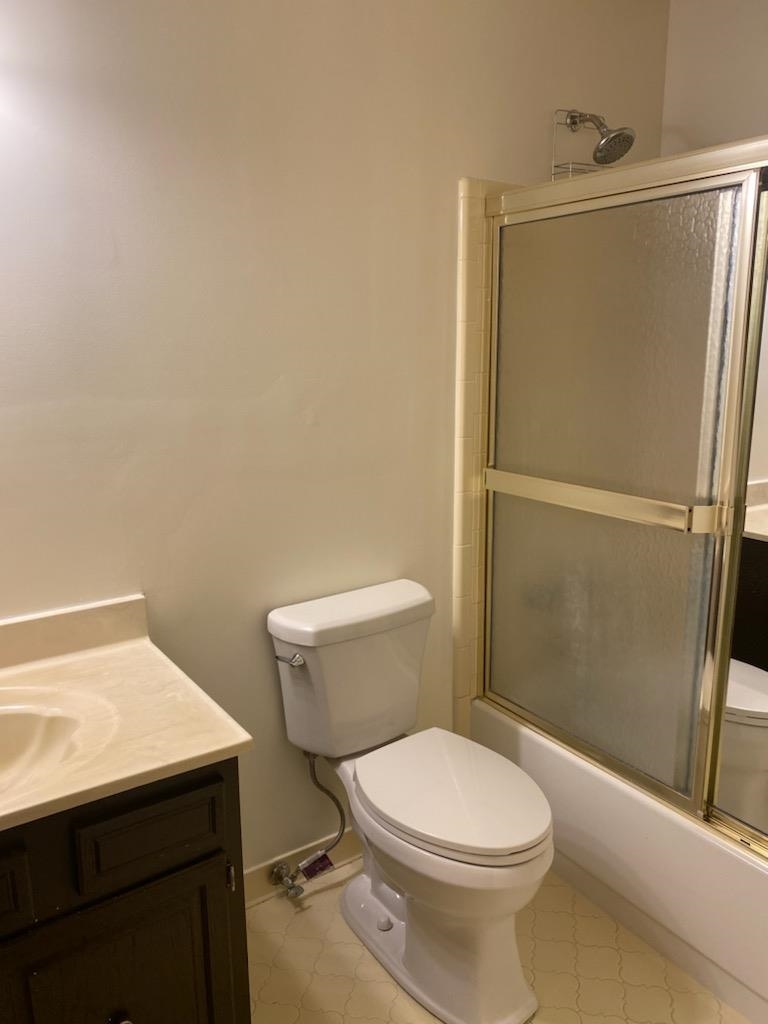 4192 Shadowfall Drive Memphis, TN 38141 - Photo 18 of 24 a white toilet sitting next to a bathroom sink