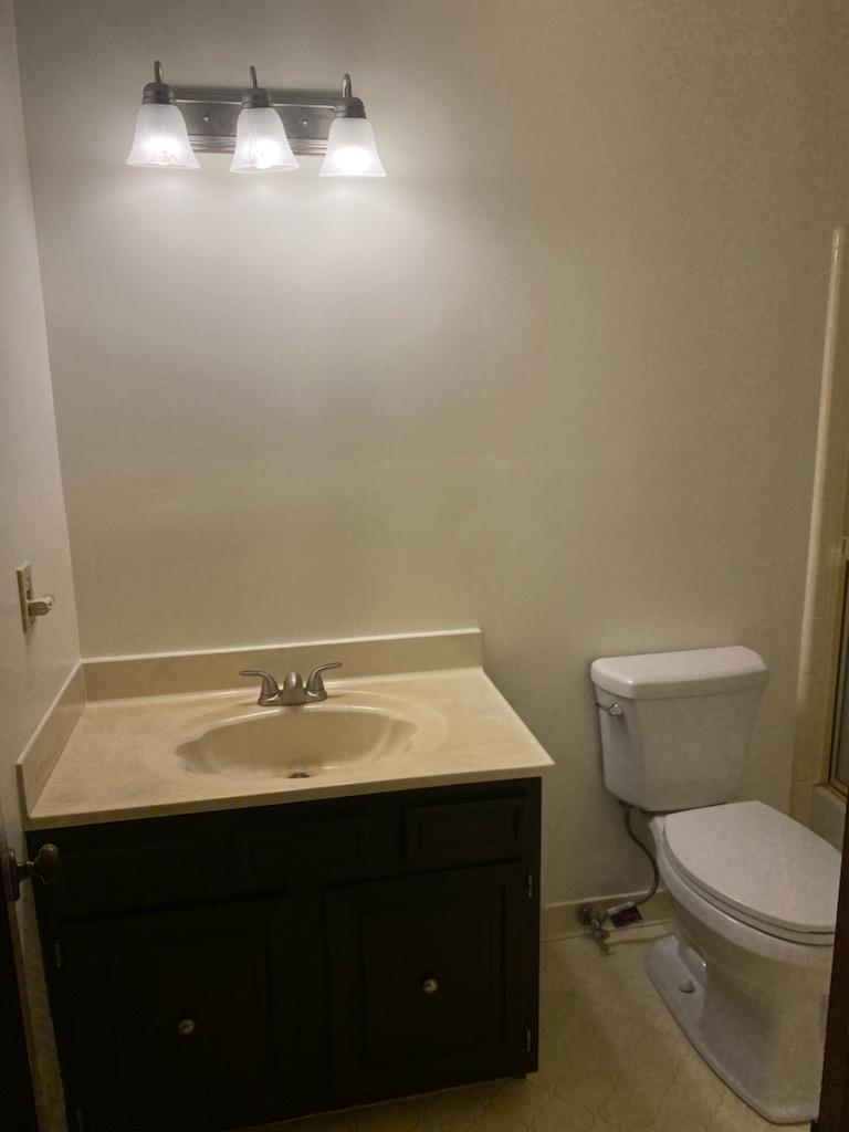 4192 Shadowfall Drive Memphis, TN 38141 - Photo 19 of 24 a bathroom with a sink vanity and toilet