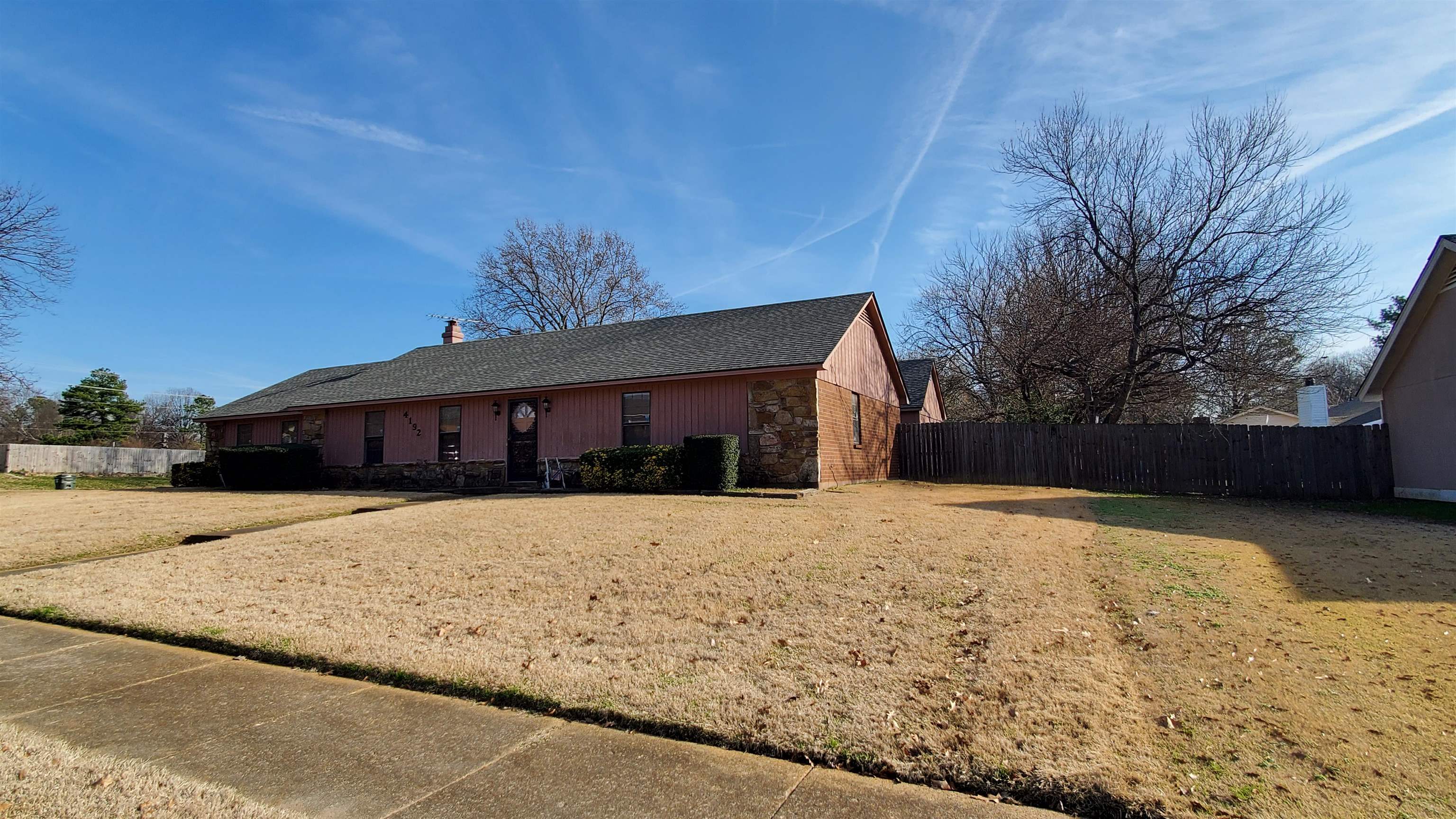 4192 Shadowfall Drive Memphis, TN 38141 - Photo 2 of 24 a front view of house with yard and trees in the background