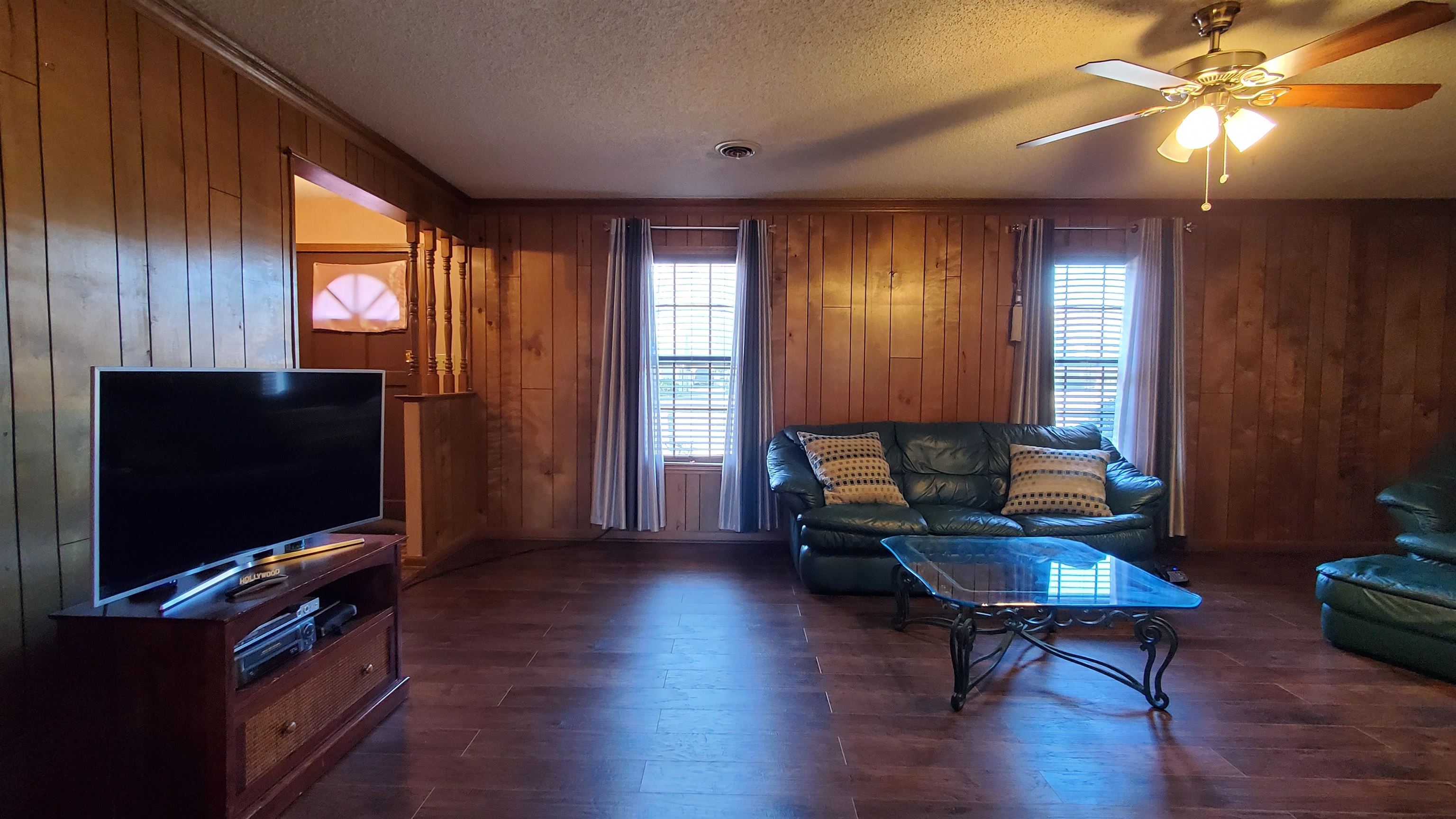4192 Shadowfall Drive Memphis, TN 38141 - Photo 6 of 24 a living room with furniture and a flat screen tv