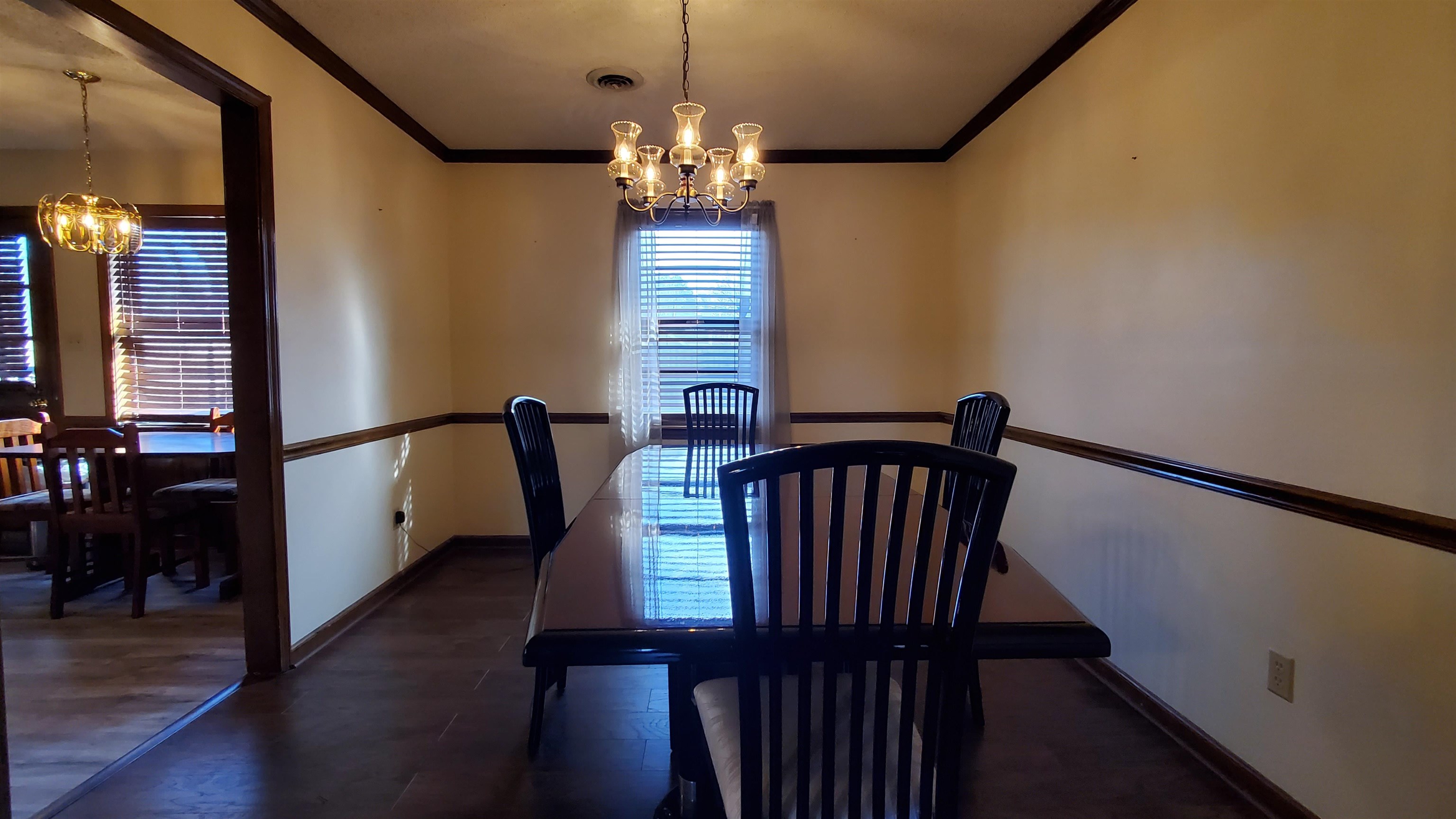 4192 Shadowfall Drive Memphis, TN 38141 - Photo 7 of 24 a view of a dining room with furniture and wooden floor