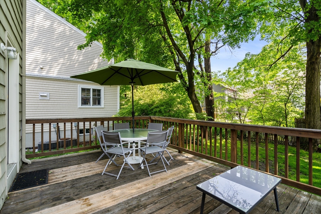 17 Charlotte Road Newton, MA 02459 - Photo 28 of 34 a view of a deck with furniture and a yard