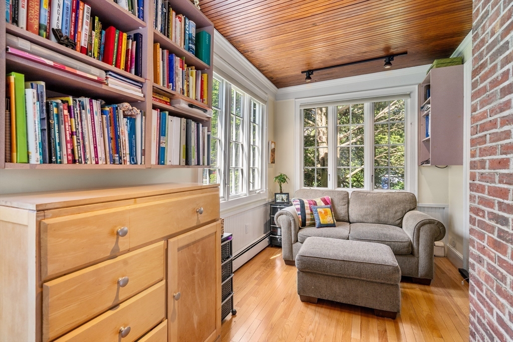17 Charlotte Road Newton, MA 02459 - Photo 10 of 34 a living room with furniture and a book shelf