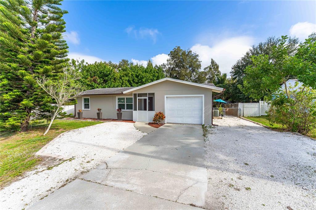 8805 Vamo Road Sarasota, FL 34231 - Photo 1 of 1 a view of a house with a yard