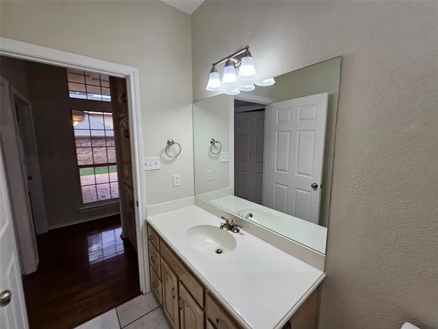 a bathroom with a sink double vanity and a mirror