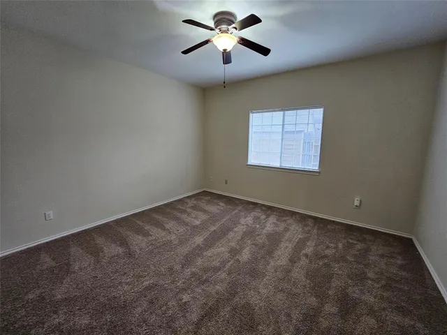 a view of a big room with carpet