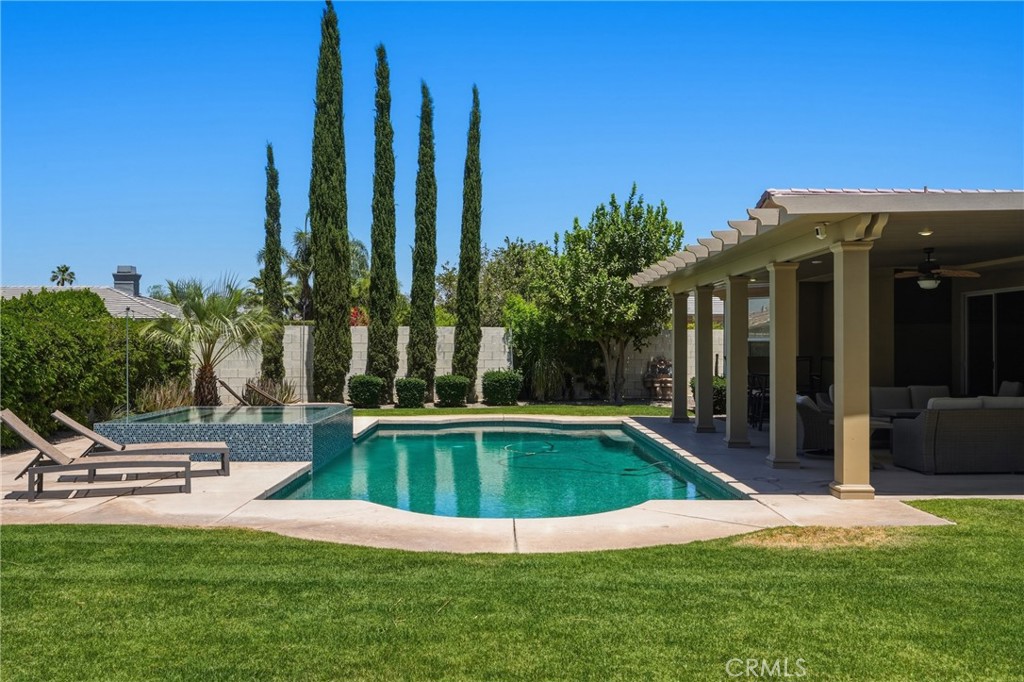 9 Orleans Road Rancho Mirage, CA 92270 - Photo 57 of 71 a view of a house with swimming pool and sitting area