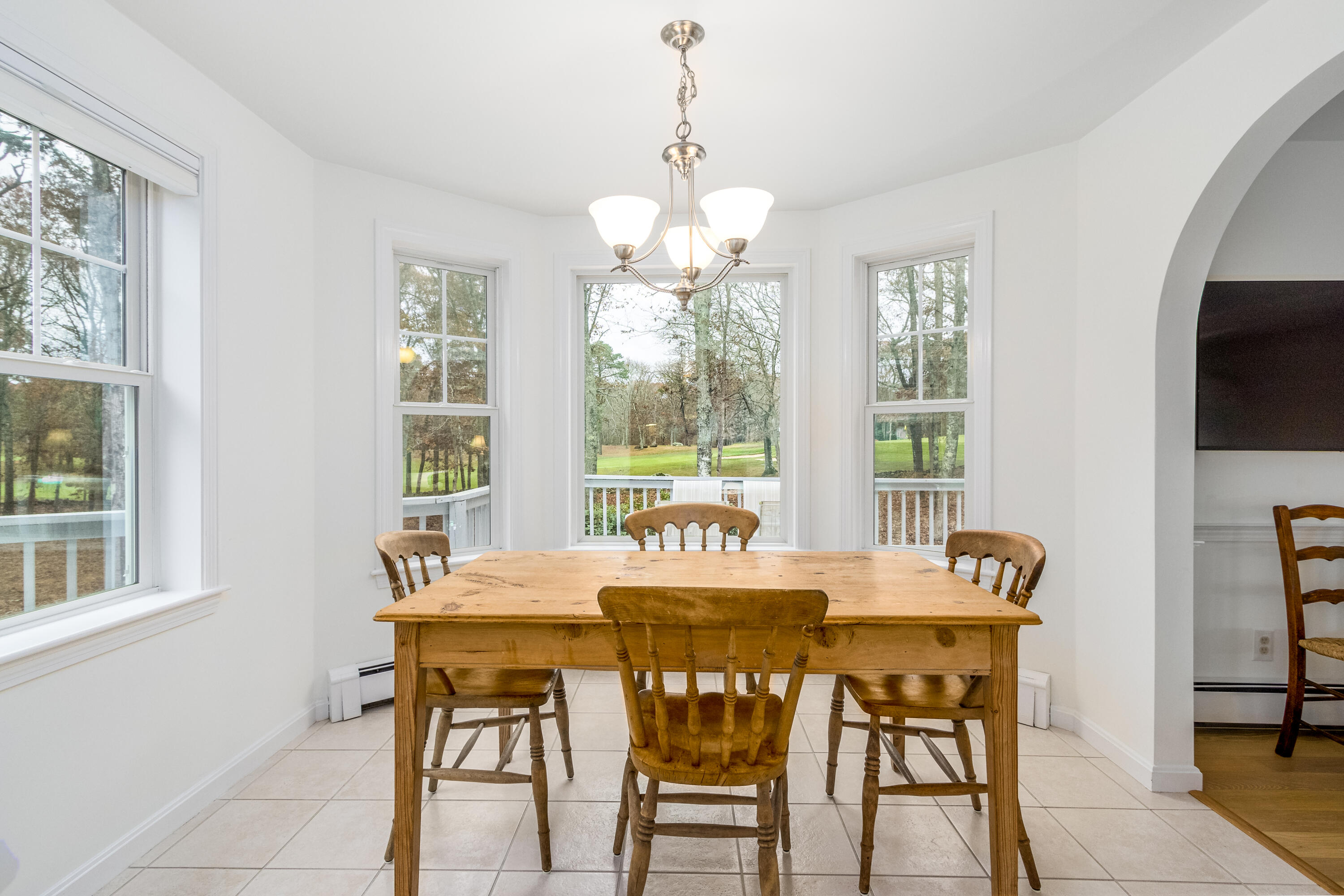 189 Dromoland Lane Barnstable, MA 02630 - Photo 13 of 40 a view of a dining room with furniture window and outside view