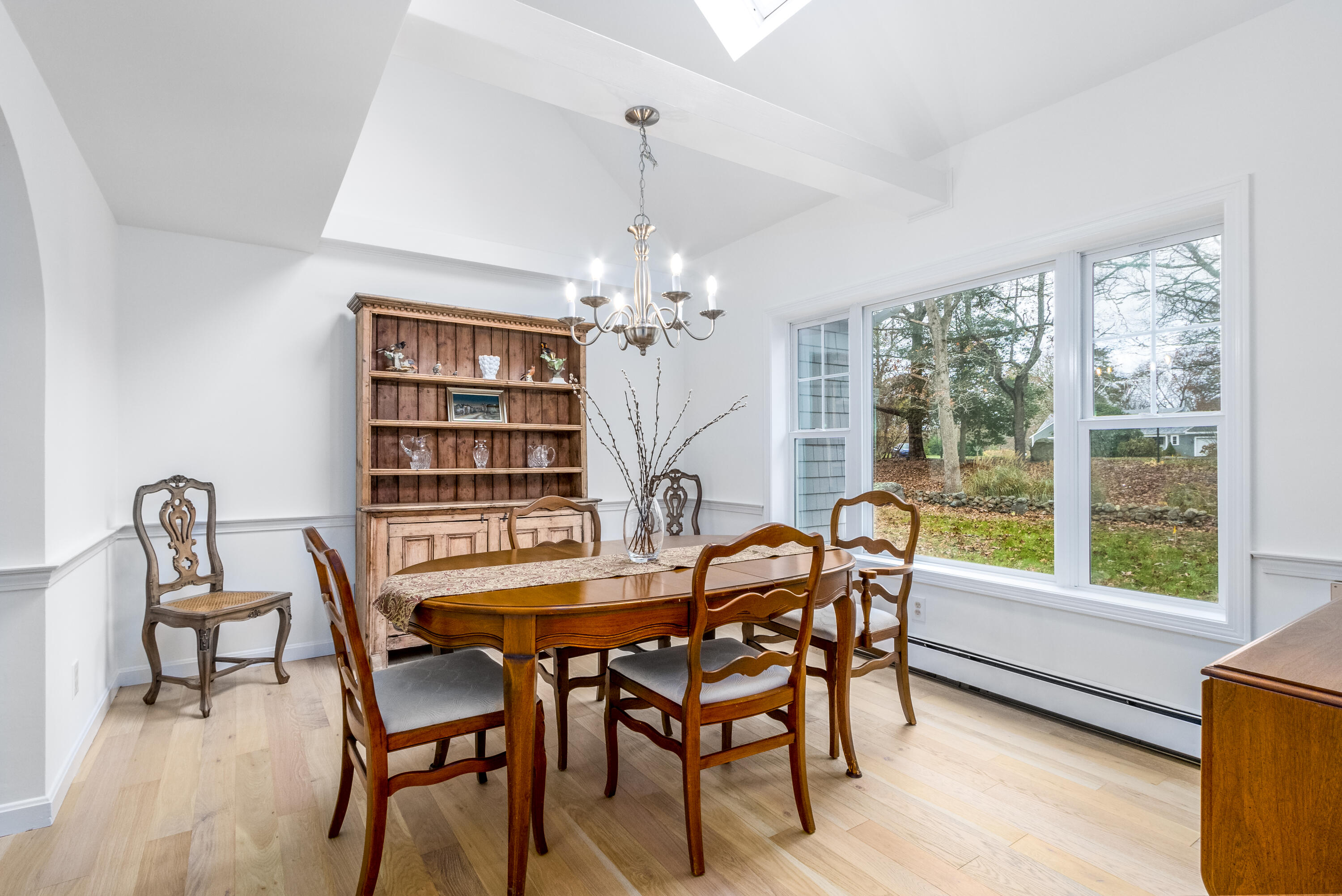 189 Dromoland Lane Barnstable, MA 02630 - Photo 14 of 40 a view of a dining room with furniture and a chandelier