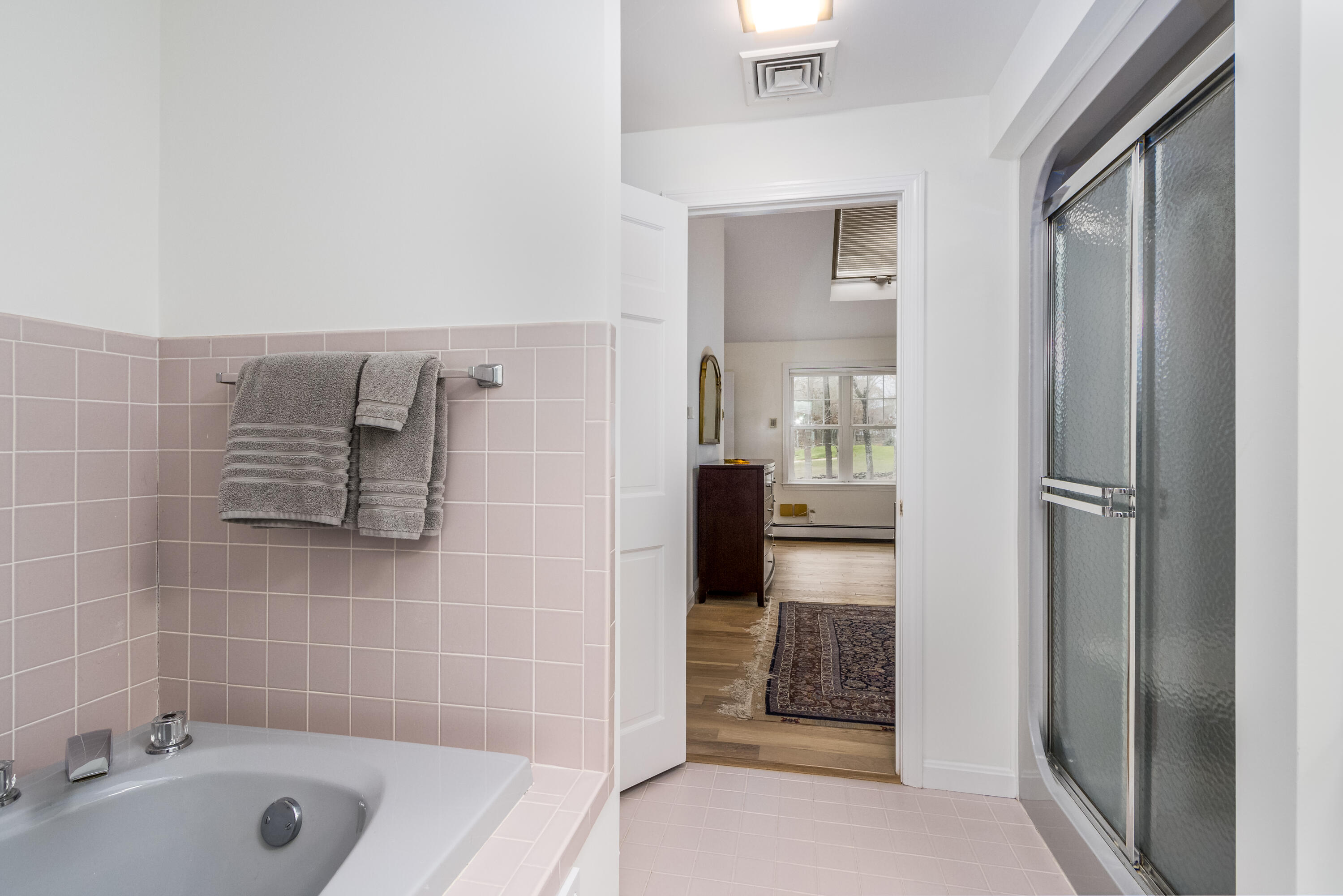 189 Dromoland Lane Barnstable, MA 02630 - Photo 20 of 40 a bathroom with a tub shower and a sink