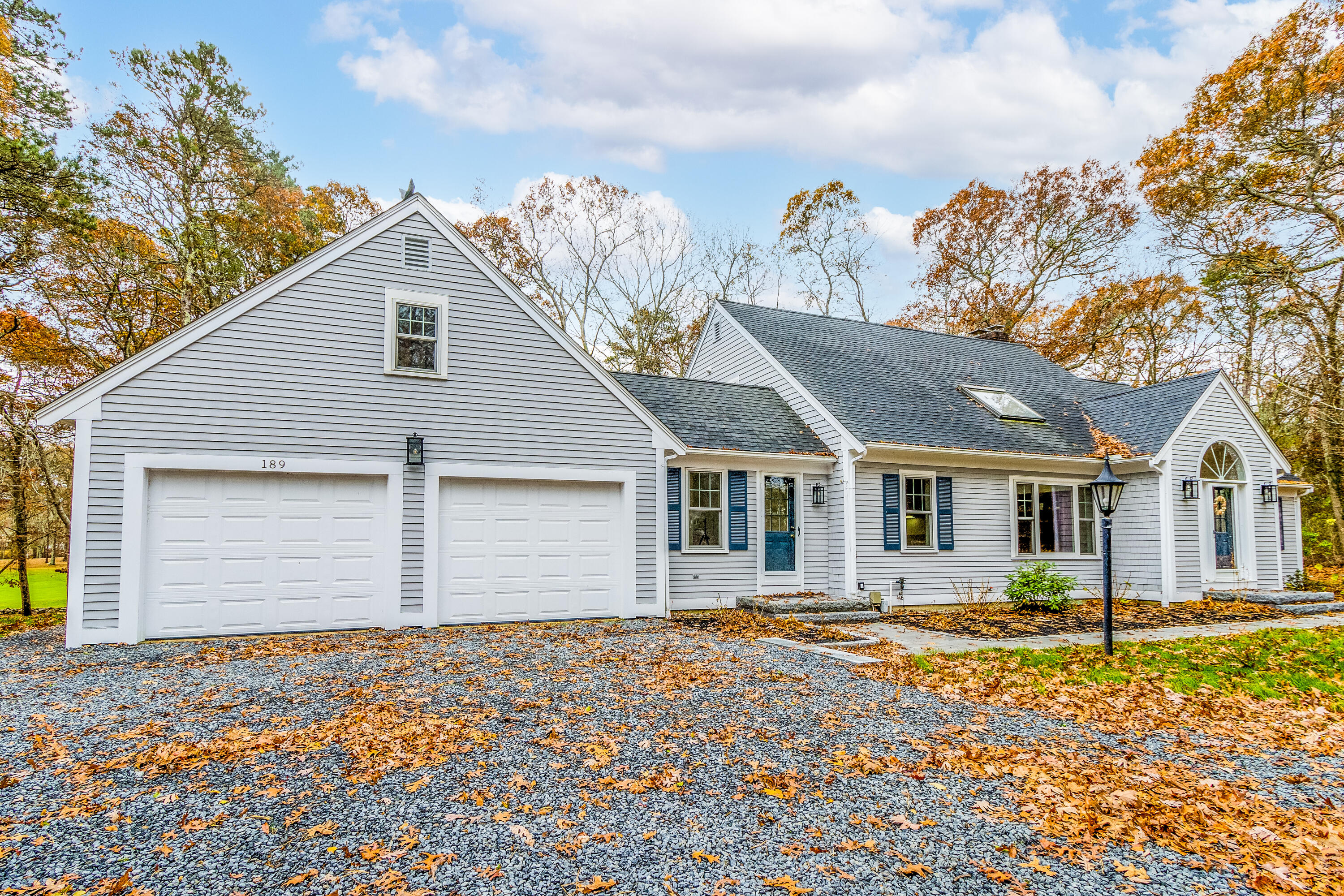 189 Dromoland Lane Barnstable, MA 02630 - Photo 26 of 40 a front view of a house with a garden