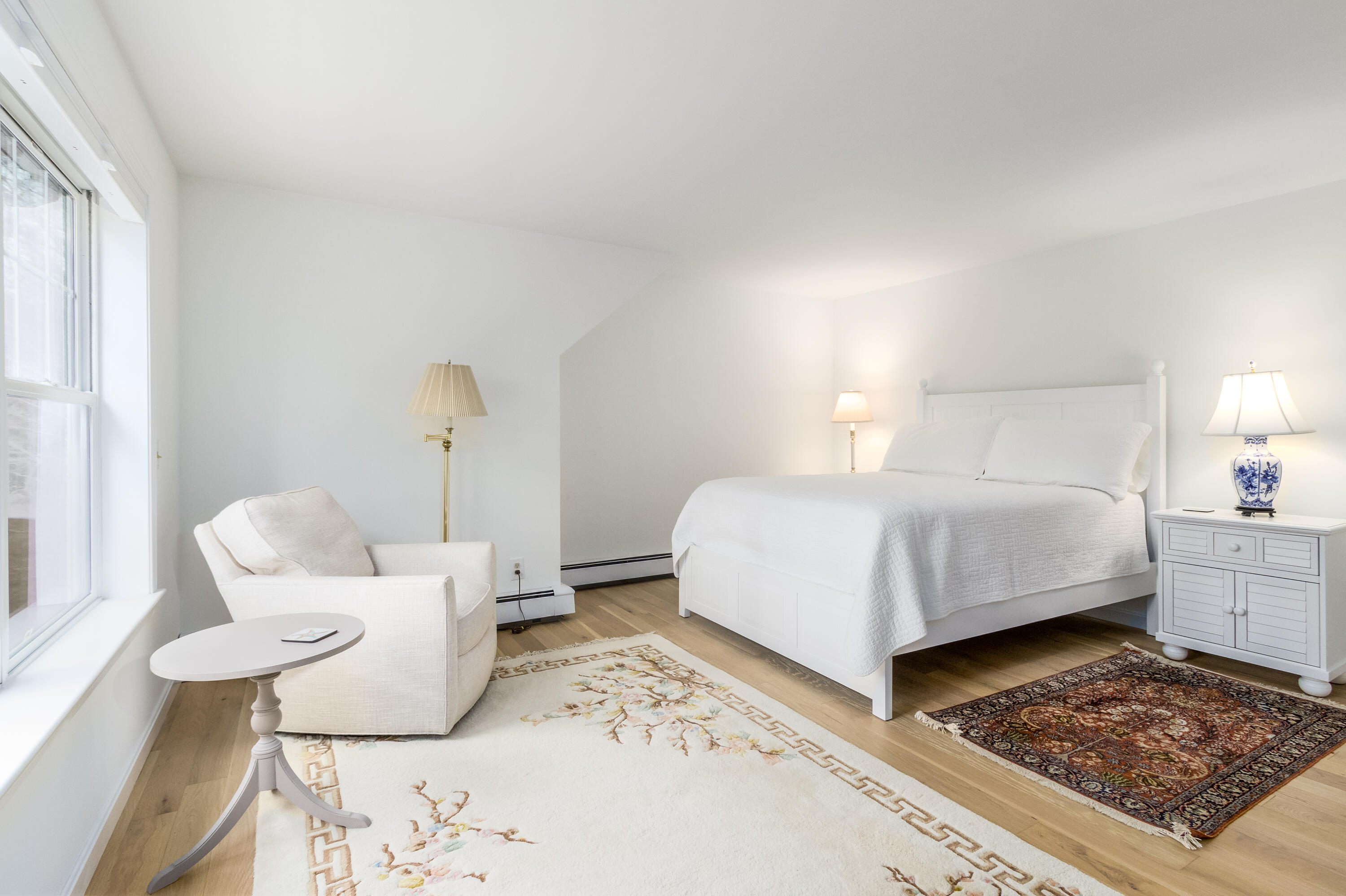 189 Dromoland Lane Barnstable, MA 02630 - Photo 28 of 40 a bedroom with a bed and wooden floor