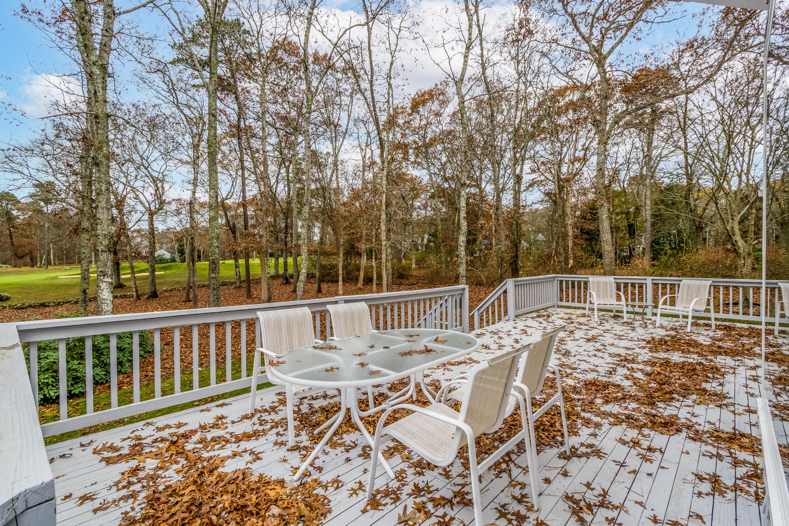 189 Dromoland Lane Barnstable, MA 02630 - Photo 31 of 40 a view of a chairs and table on the deck