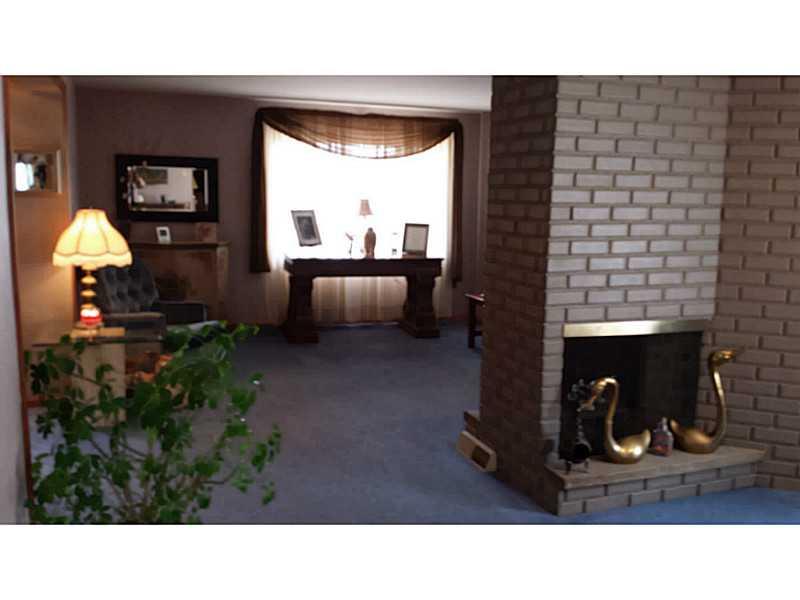 808 9th Street McKees Rocks, PA 15136 - Photo 9 of 23 Living Room. Nice decorative fireplace, both livingroom and dining room sides