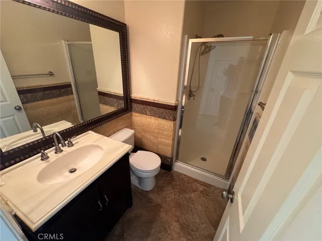a spacious bathroom with a double vanity sink mirror and double