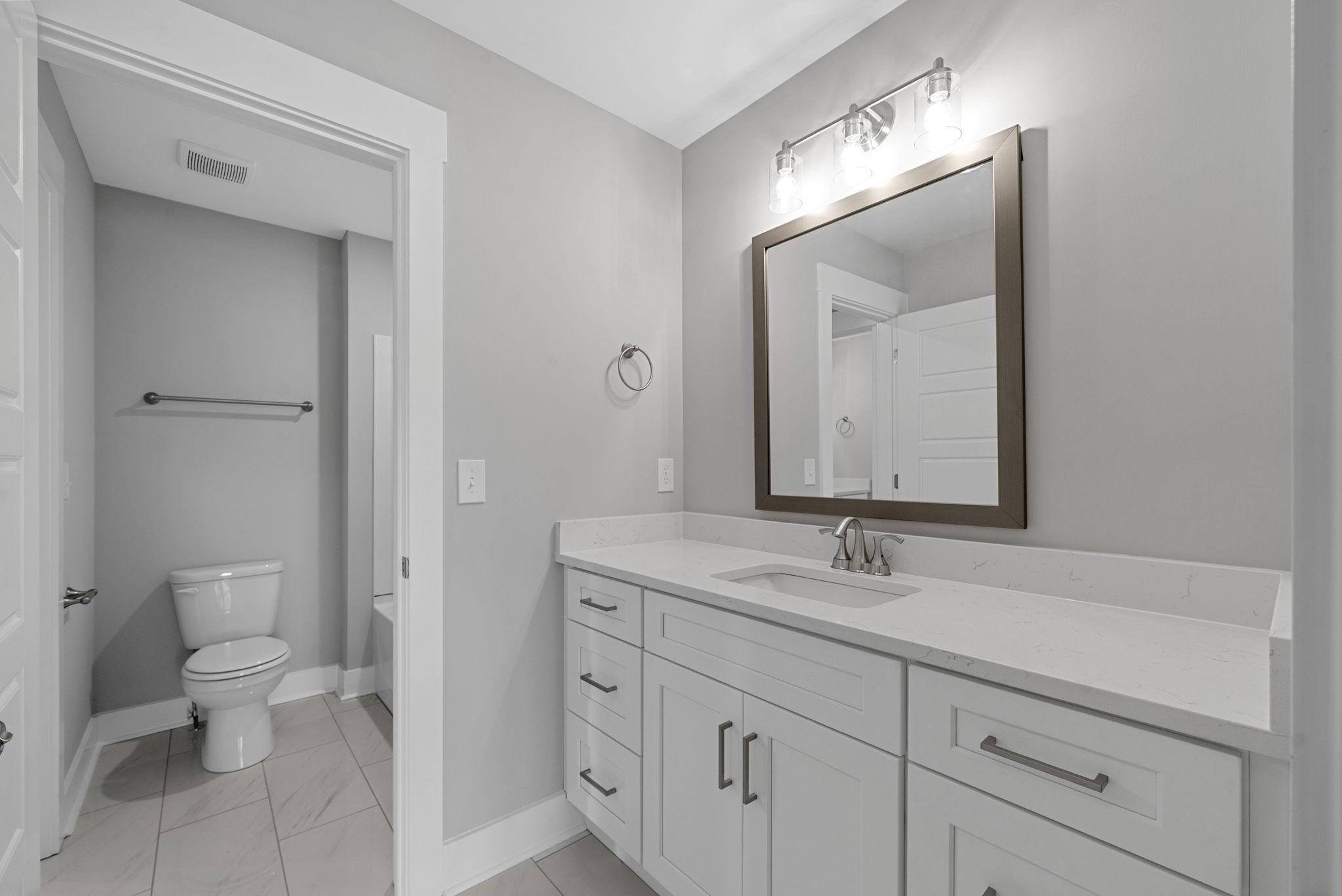 1808 Gholson Road Clarksville, TN 37043 - Photo 13 of 36 a bathroom with a toilet sink and mirror