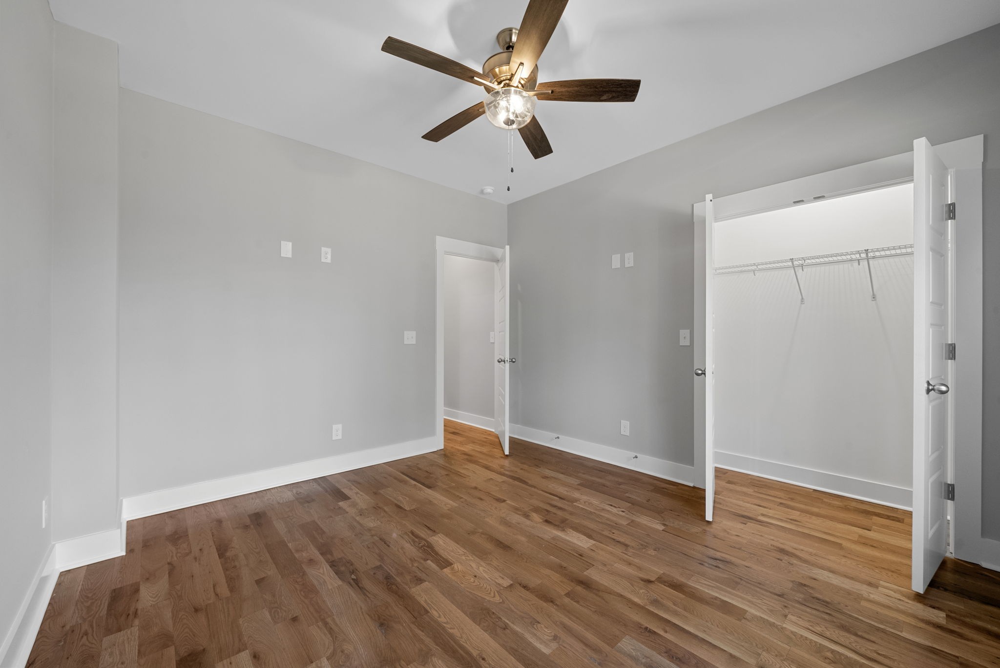 1808 Gholson Road Clarksville, TN 37043 - Photo 20 of 36 an empty room with wooden floor and ceiling fan
