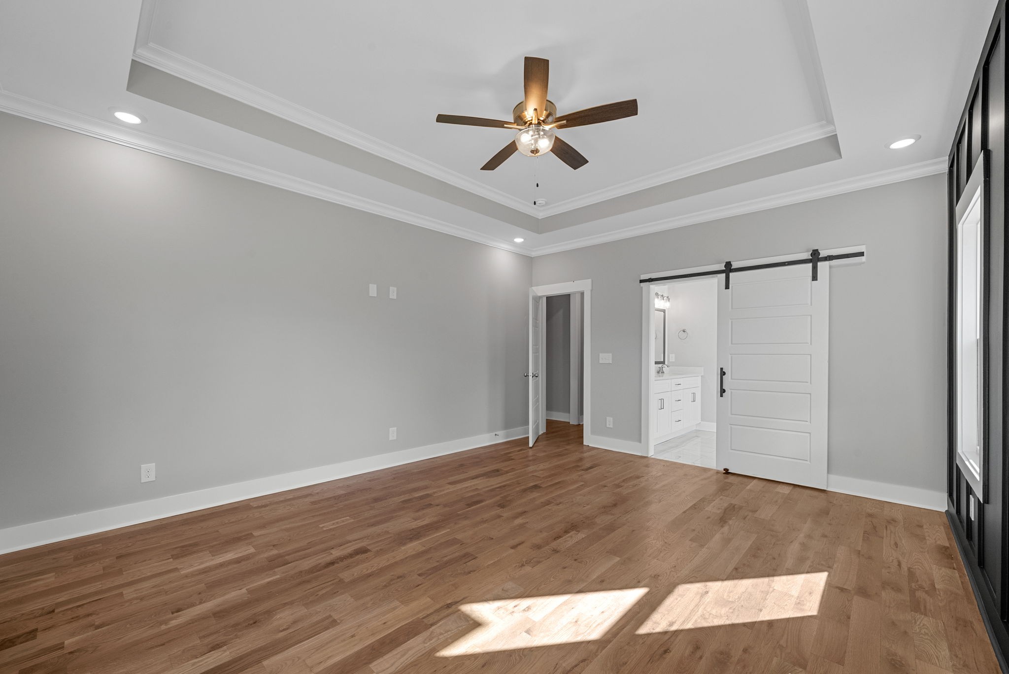 1808 Gholson Road Clarksville, TN 37043 - Photo 27 of 36 a view of a livingroom with a ceiling fan and wooden floor