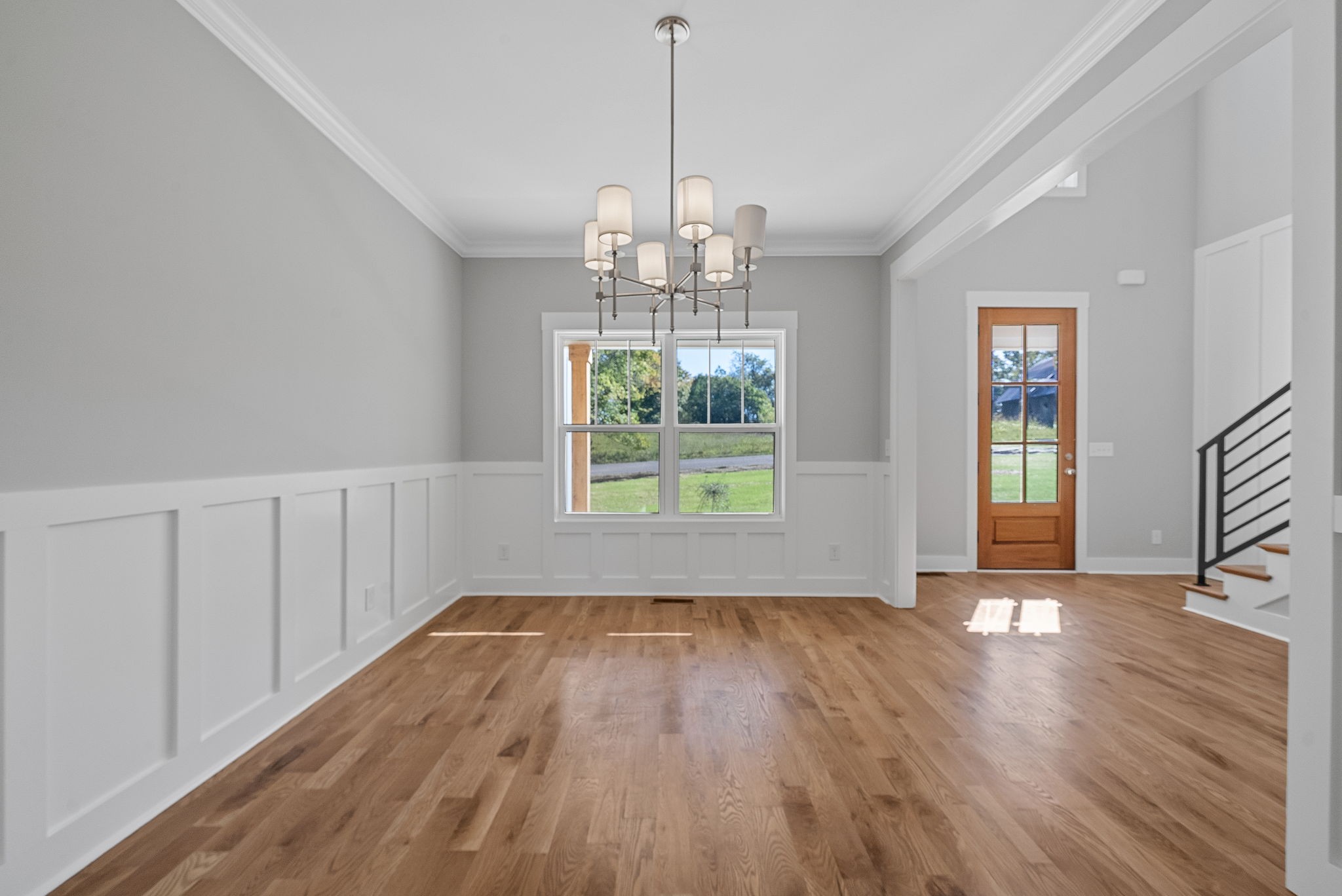 1808 Gholson Road Clarksville, TN 37043 - Photo 7 of 36 a view of an empty room with wooden floor and a window