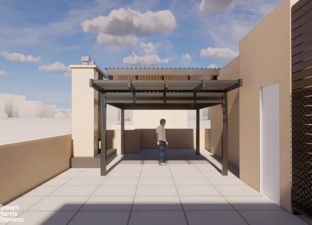 a view of roof deck with a table and chairs