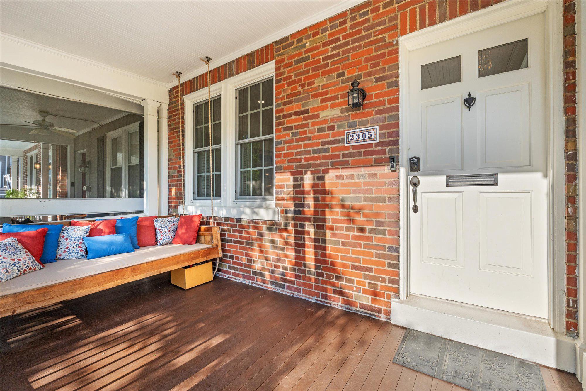 2305 38th Street Northwest Washington, DC 20007 - Photo 2 of 38 a view of a deck with couch and wooden floor