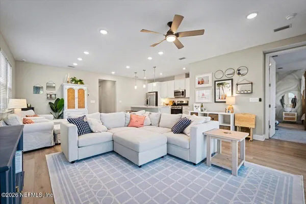 a living room with furniture and a large window