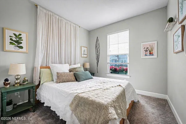 a bathroom with a glass shower door and a bathtub