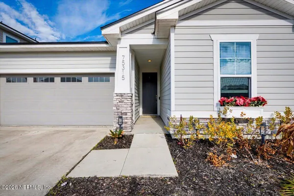 a front view of a house with a garage