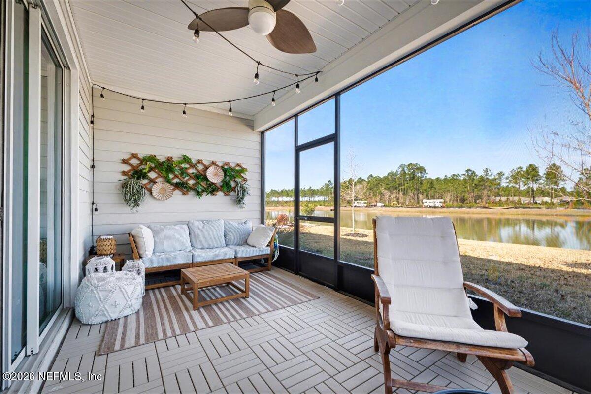 75315 Plumbago Yulee, FL 32097 - Photo 27 of 37 a balcony with wooden floor and outdoor seating