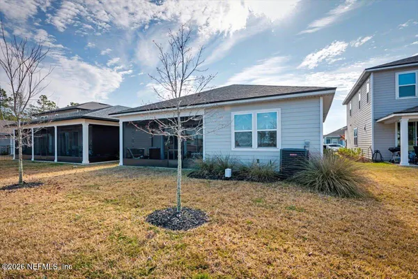 a view of swimming pool with outdoor seating and yard in the back