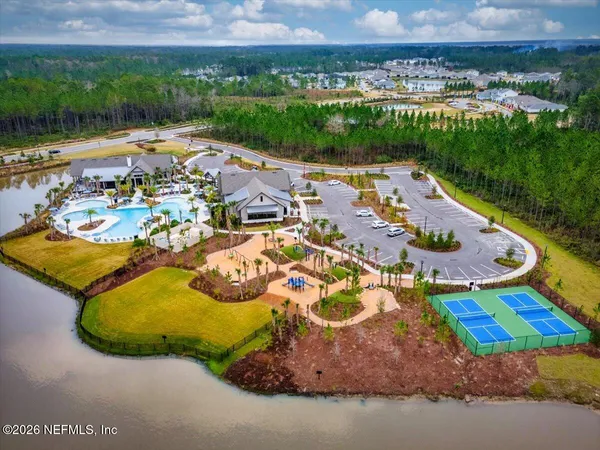 a view of a swimming pool with a yard