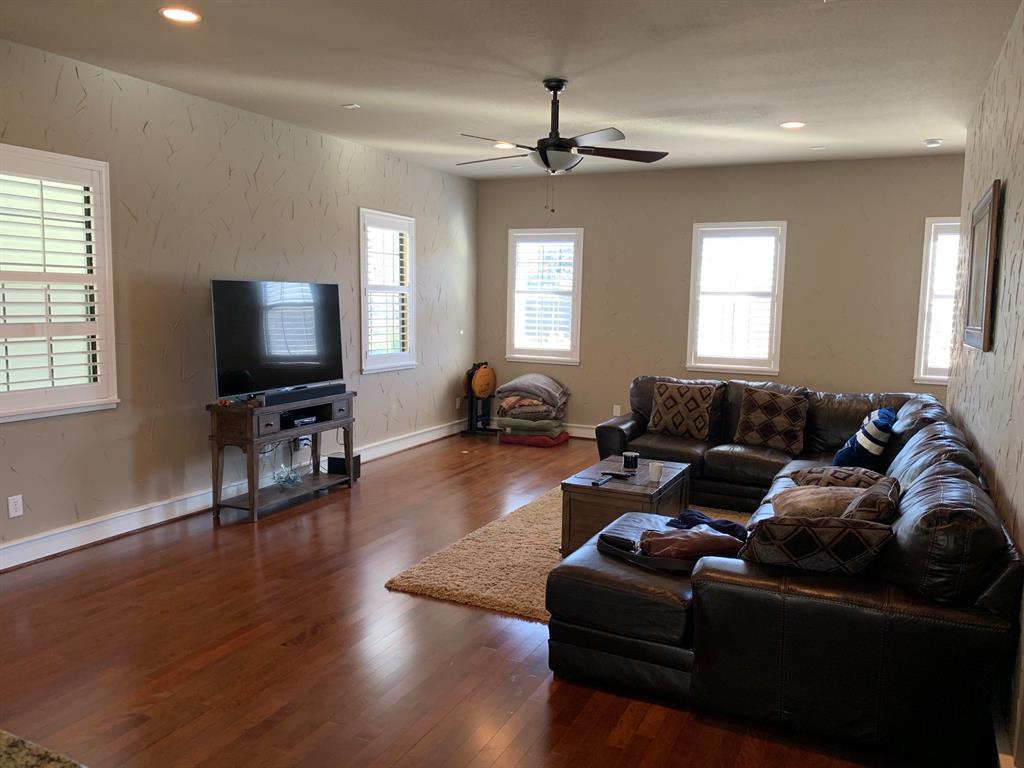 3407 Bryan Street, Unit E Dallas, TX 75204 - Photo 2 of 12 a living room with furniture and a flat screen tv