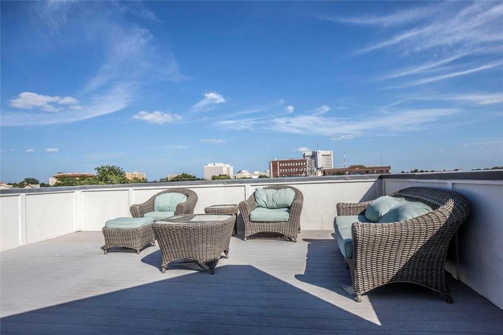 3407 Bryan Street, Unit E Dallas, TX 75204 - Photo 4 of 12 a roof deck with couches and potted plants