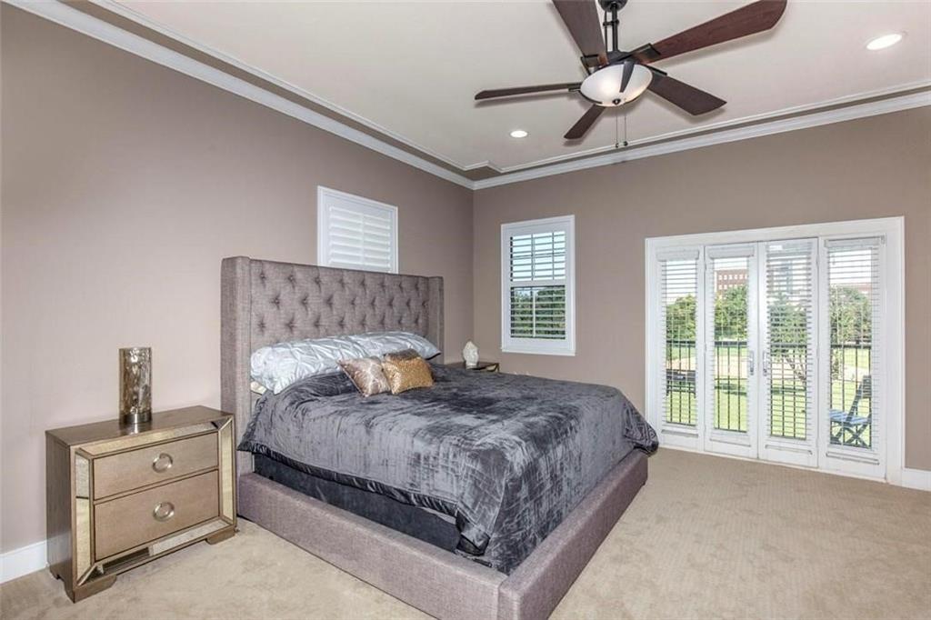 3407 Bryan Street, Unit E Dallas, TX 75204 - Photo 8 of 12 a bedroom with a large bed and a window