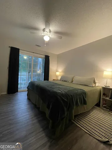 a bedroom with a bed and a walk in closet